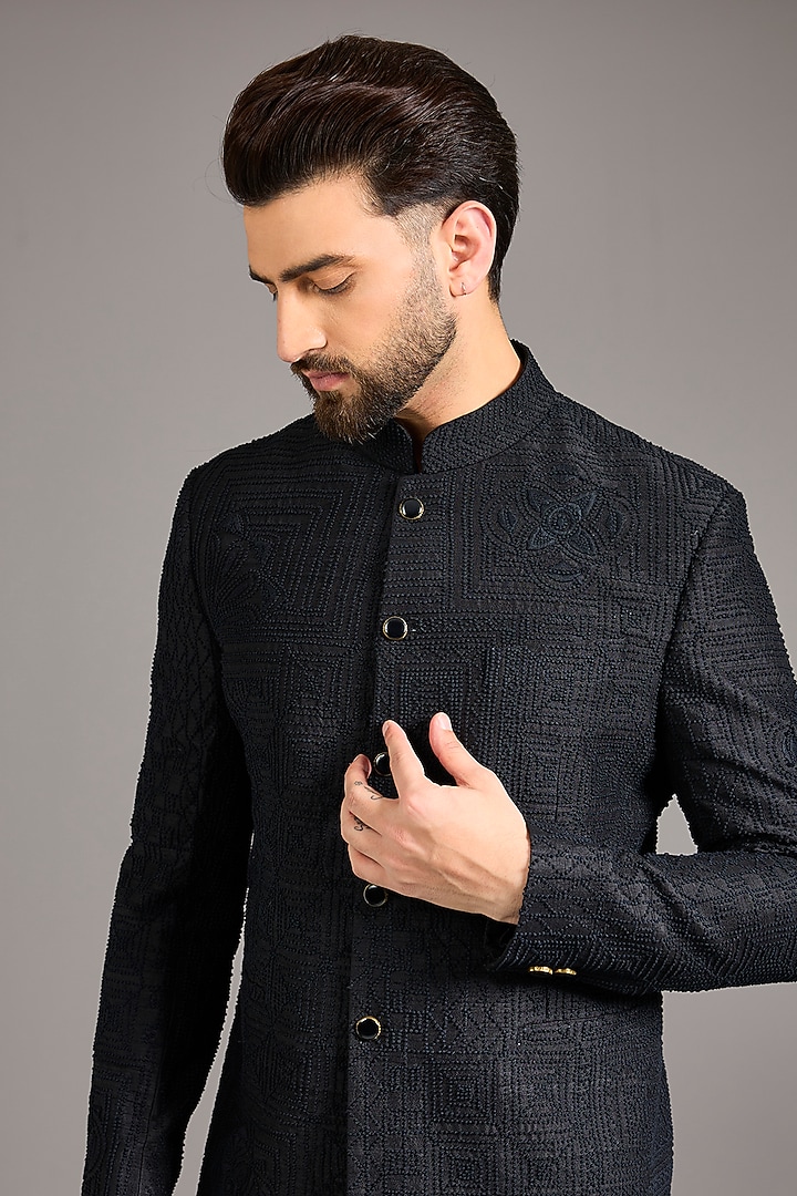 Black Raw Silk French Knot Embroidered Groom Bandhgala Set by Divyam Mehta Men at Pernia's Pop Up Shop