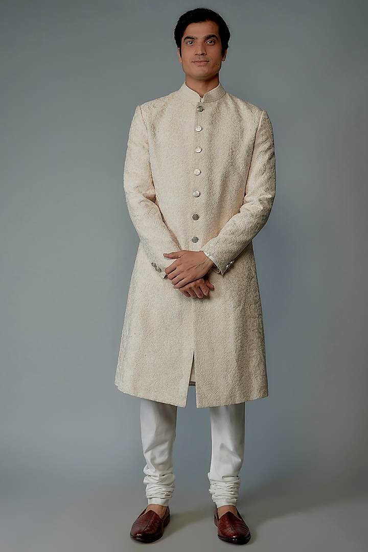 Ivory Silk Embroidered Sherwani Set by Divyam Mehta Men