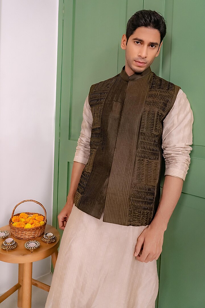 Deep Olive Green Silk Textured Bundi Jacket Set by DMODE at Pernia's Pop Up Shop