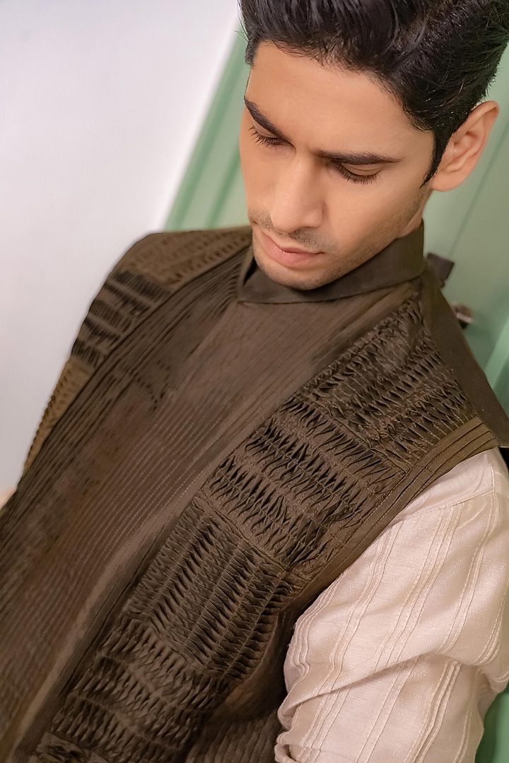 Deep Olive Green Silk Textured Bundi Jacket Set by DMODE at Pernia's Pop Up Shop