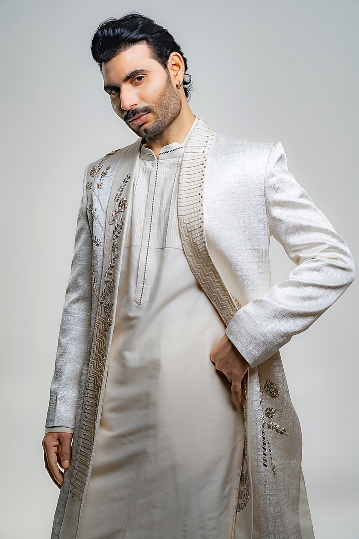 Ivory Suiting Textured Embroidered Open Groom Sherwani Set by DMODE at Pernia's Pop Up Shop