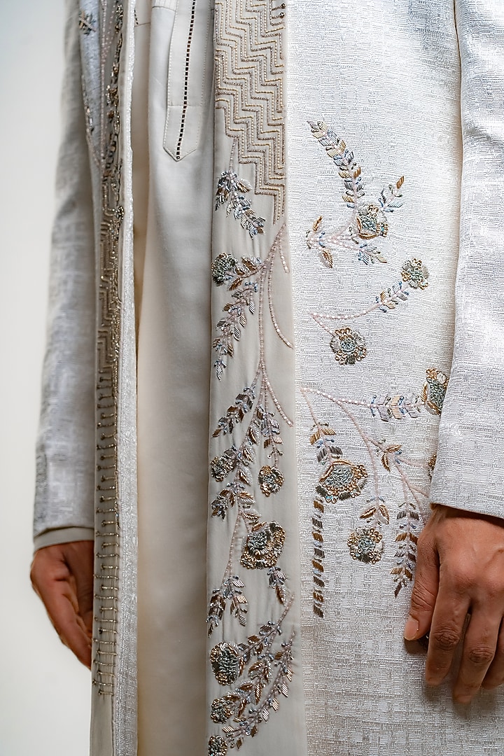 Ivory Suiting Textured Embroidered Open Groom Sherwani Set by DMODE at Pernia's Pop Up Shop
