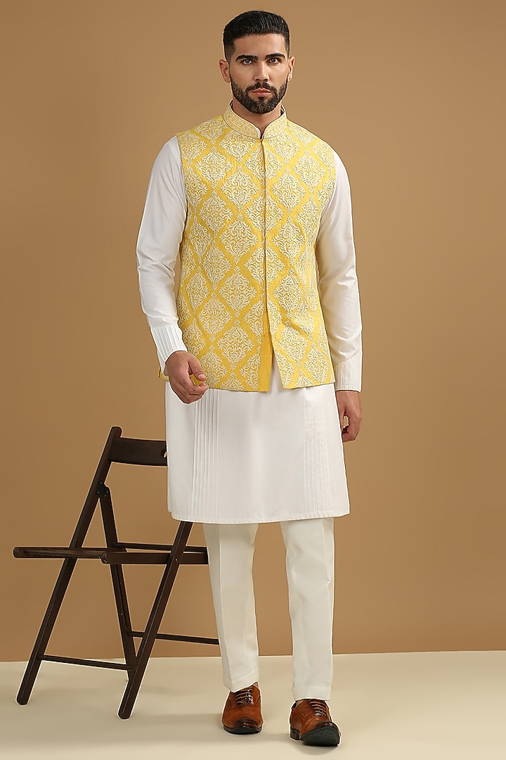 Yellow Dupion Silk Floral Embroidered Bundi Jacket Set by DMODE at Pernia's Pop Up Shop