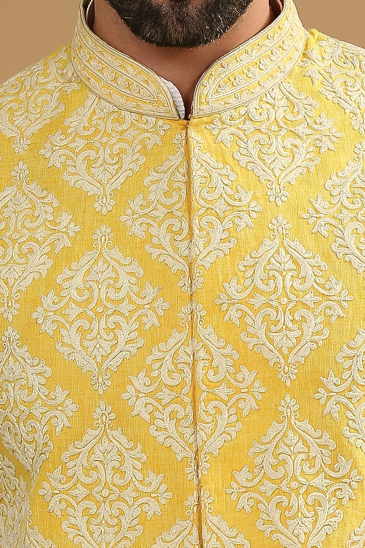 Yellow Dupion Silk Floral Embroidered Bundi Jacket Set by DMODE at Pernia's Pop Up Shop