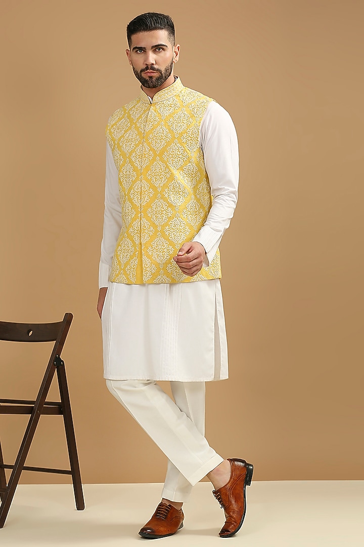 Yellow Dupion Silk Floral Embroidered Bundi Jacket Set by DMODE at Pernia's Pop Up Shop