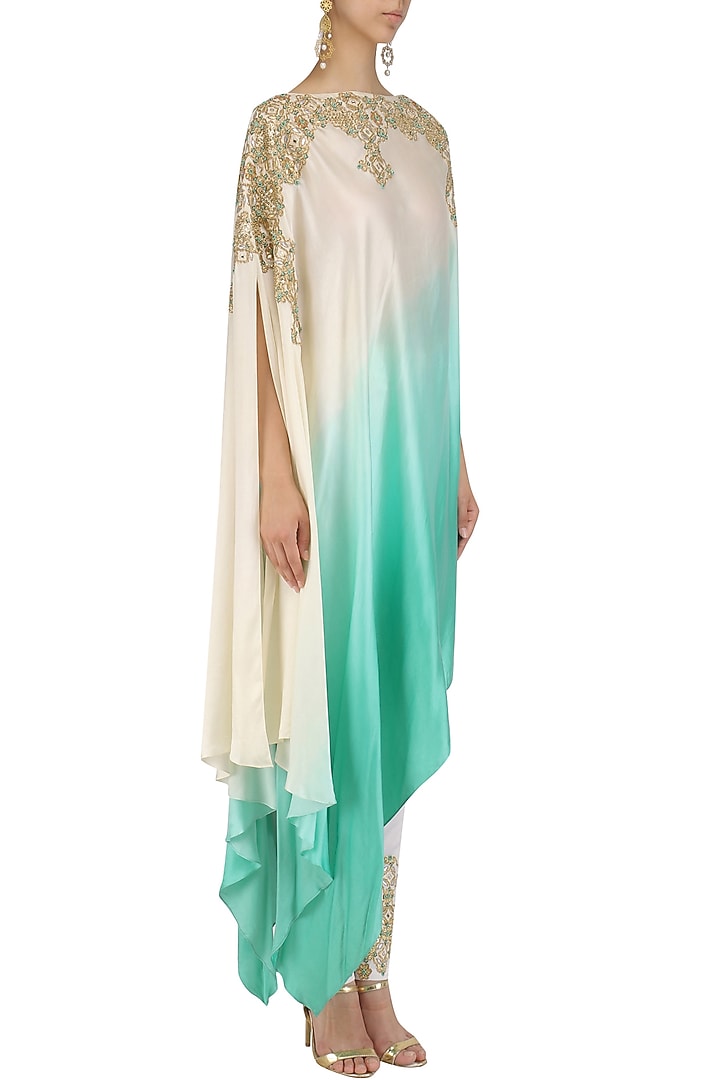White and blue one shoulder kaftan and pants set available only at Pernia's Pop Up Shop.