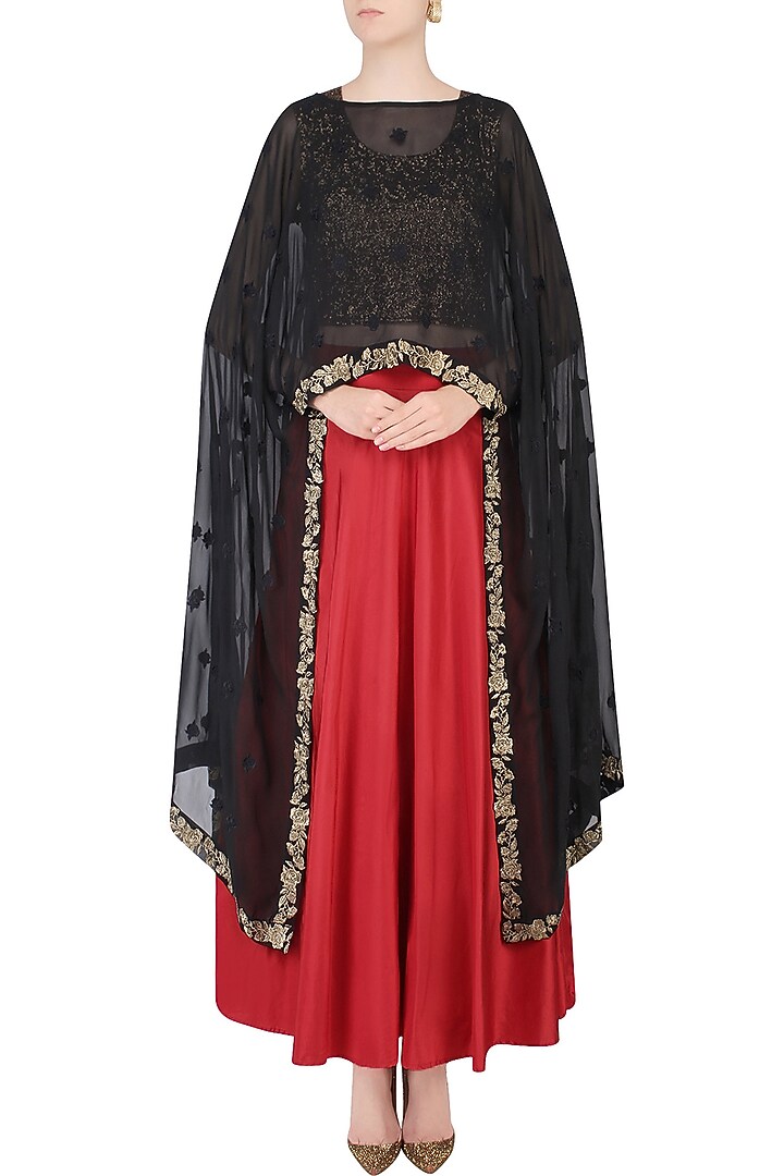 Black floral embroidered cape with crop top and red skirt available only at Pernia's Pop Up Shop.