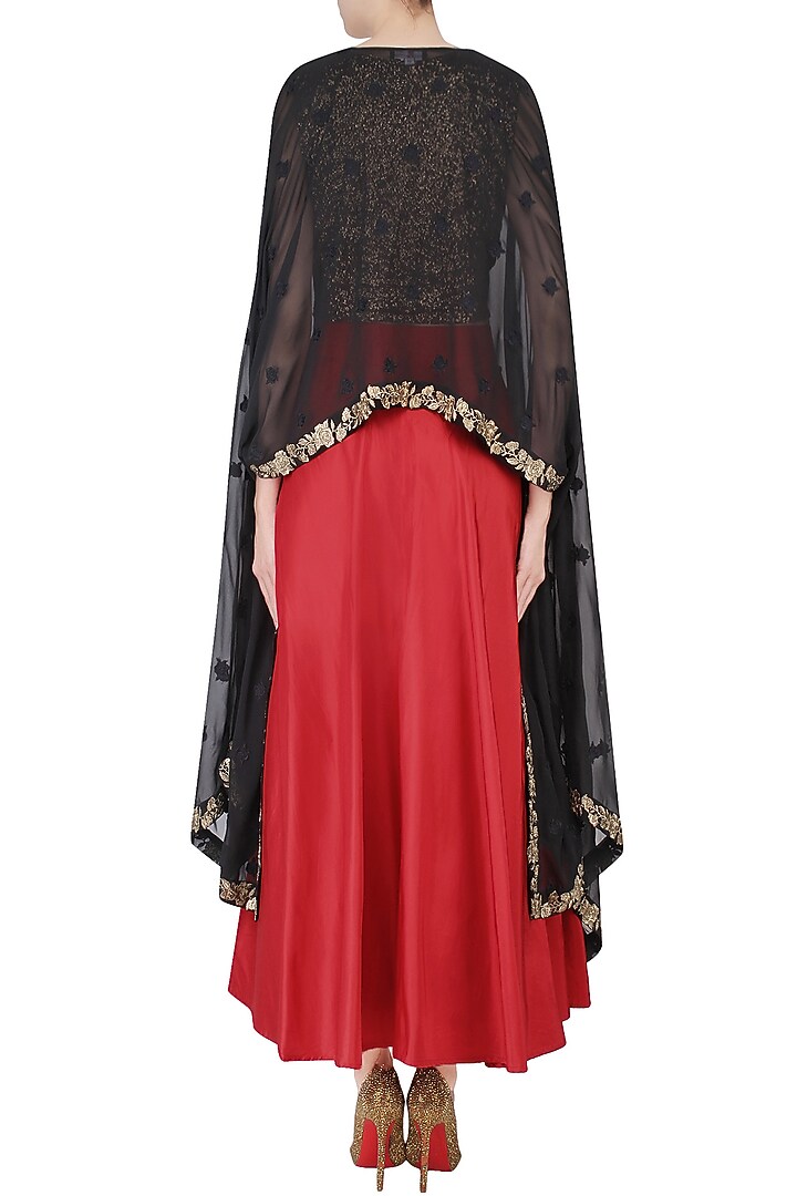 Black floral embroidered cape with crop top and red skirt available only at Pernia's Pop Up Shop.