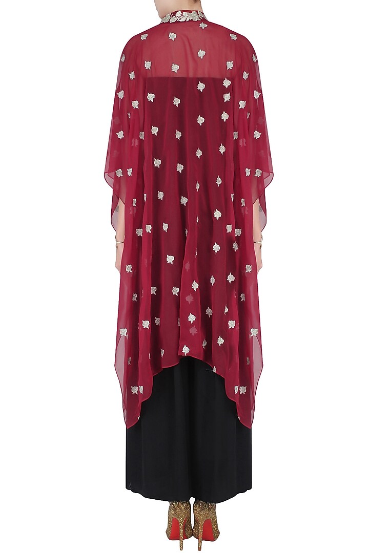 Red floral embroidered cape with black palazzo pants available only at Pernia's Pop Up Shop.