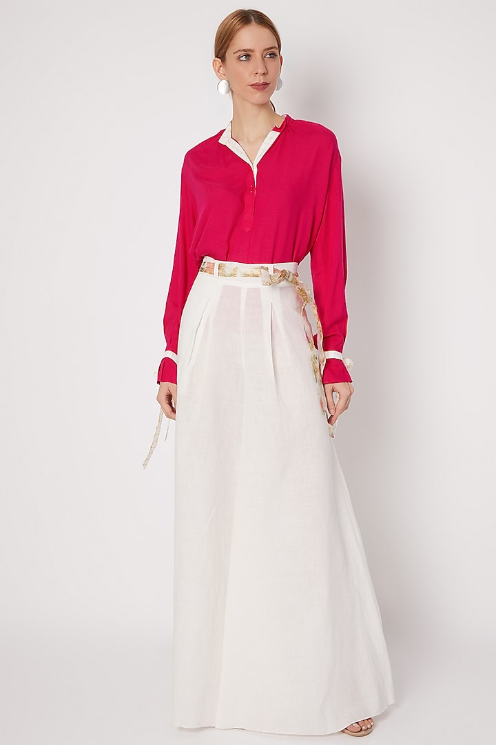 White Pleated Flared Pants With Belt by Dilnaz Karbhary