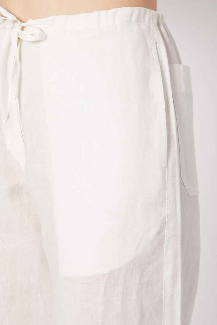 Ivory Pants With Drawstring by Dilnaz Karbhary at Pernia's Pop Up Shop