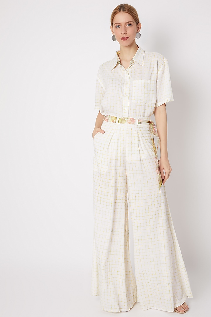 White & Yellow Pleated Pants With Belt by Dilnaz Karbhary