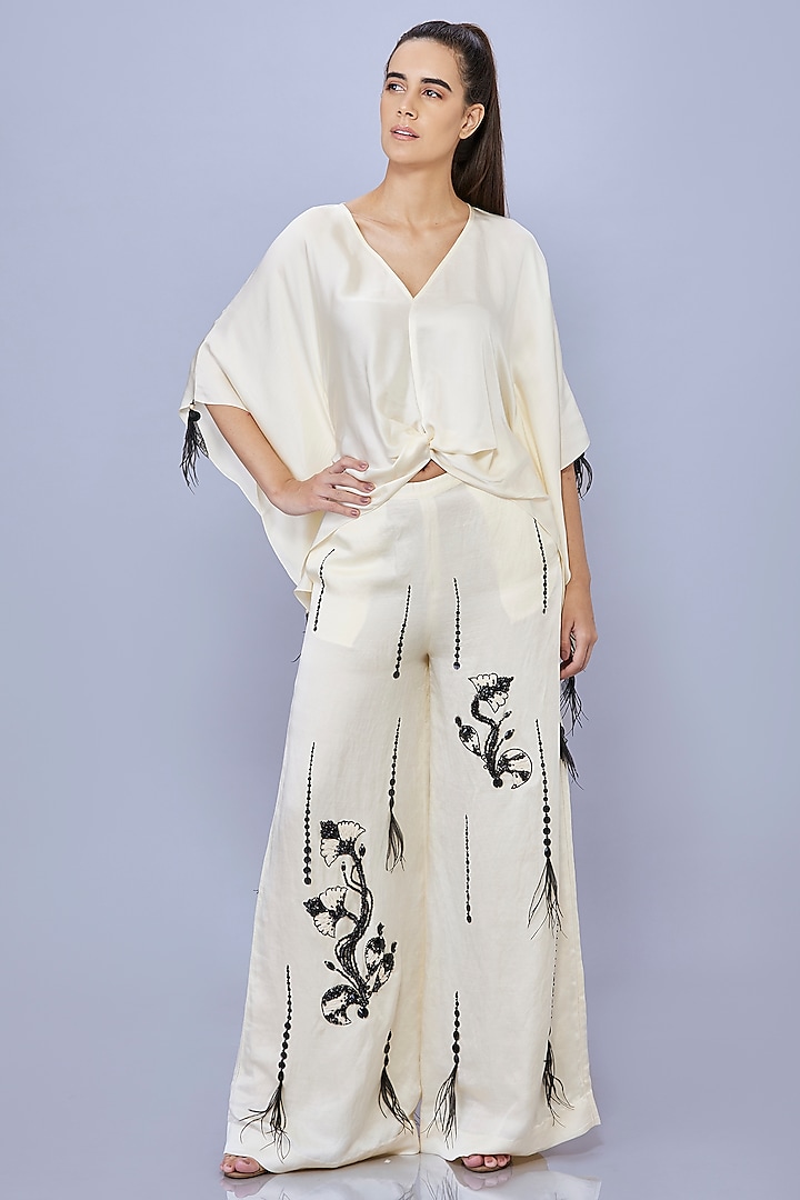 Cream Blended Satin Linen Motif Embroidered Trousers by Dilnaz Karbhary at Pernia's Pop Up Shop