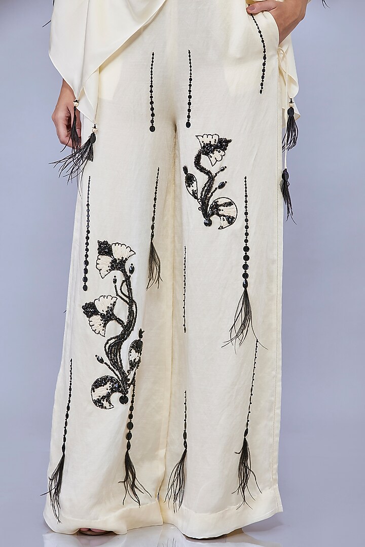 Cream Blended Satin Linen Motif Embroidered Trousers by Dilnaz Karbhary at Pernia's Pop Up Shop