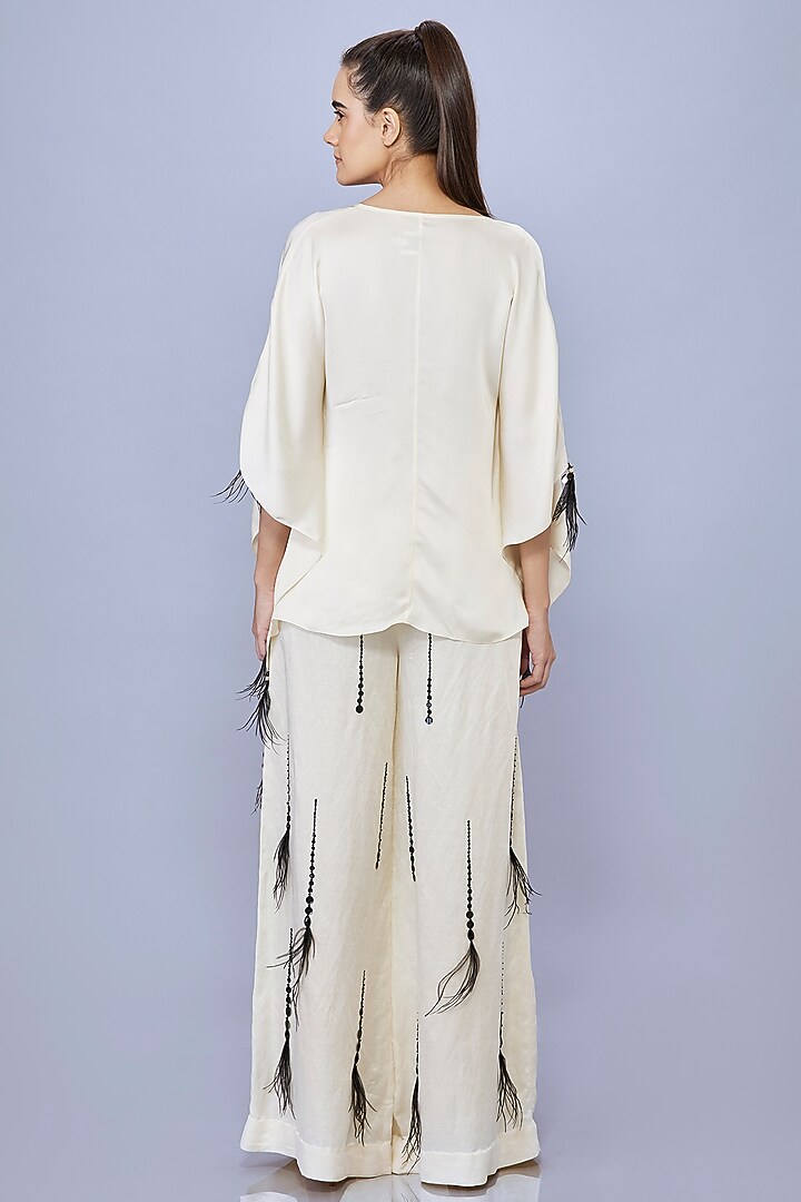 Cream Blended Satin Linen Motif Embroidered Trousers by Dilnaz Karbhary at Pernia's Pop Up Shop
