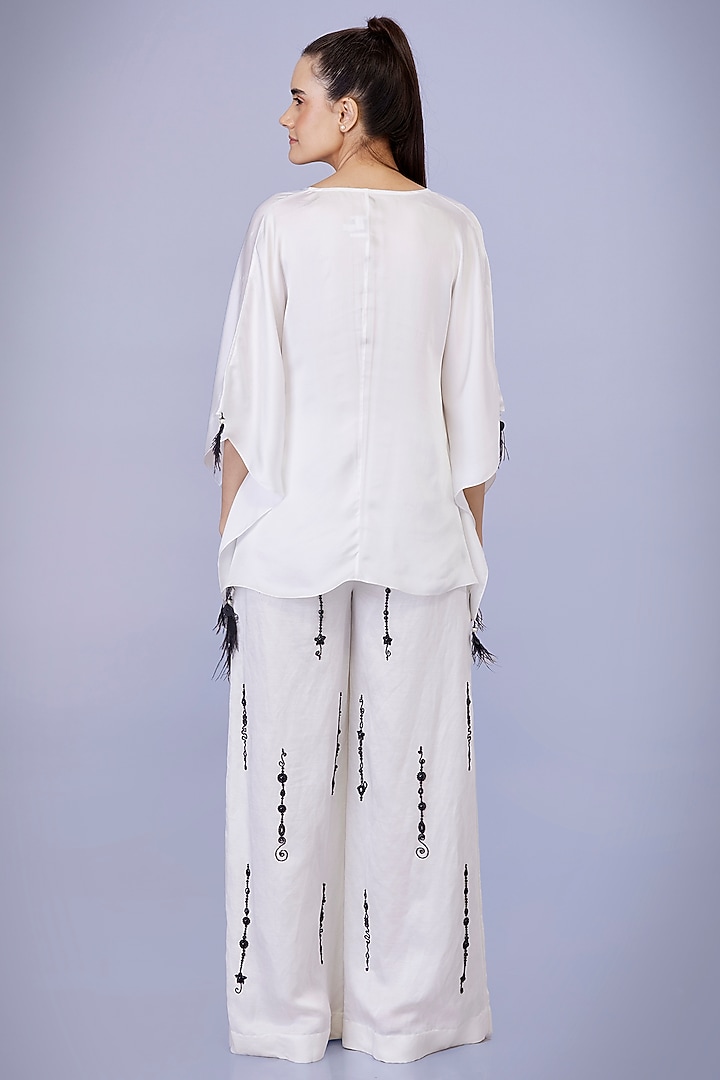 Ivory Blended Satin Linen Snowflakes Embroidered Trousers by Dilnaz Karbhary at Pernia's Pop Up Shop