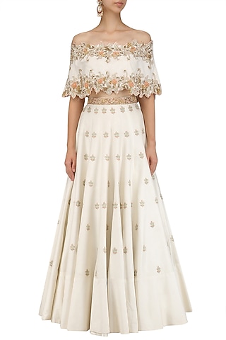 Ivory Off Shoulder Cape with Lehenga Set by Nitika Kanodia Gupta