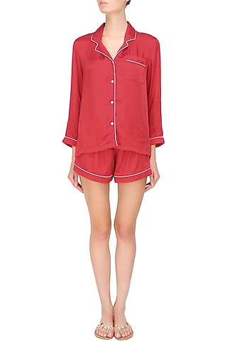 Red satin shirt and shorts set by Dandelion