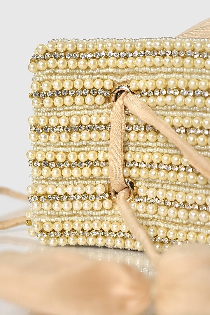Beige Raw Silk Embellished Modak Potli by House of D'oro at Pernia's Pop Up Shop
