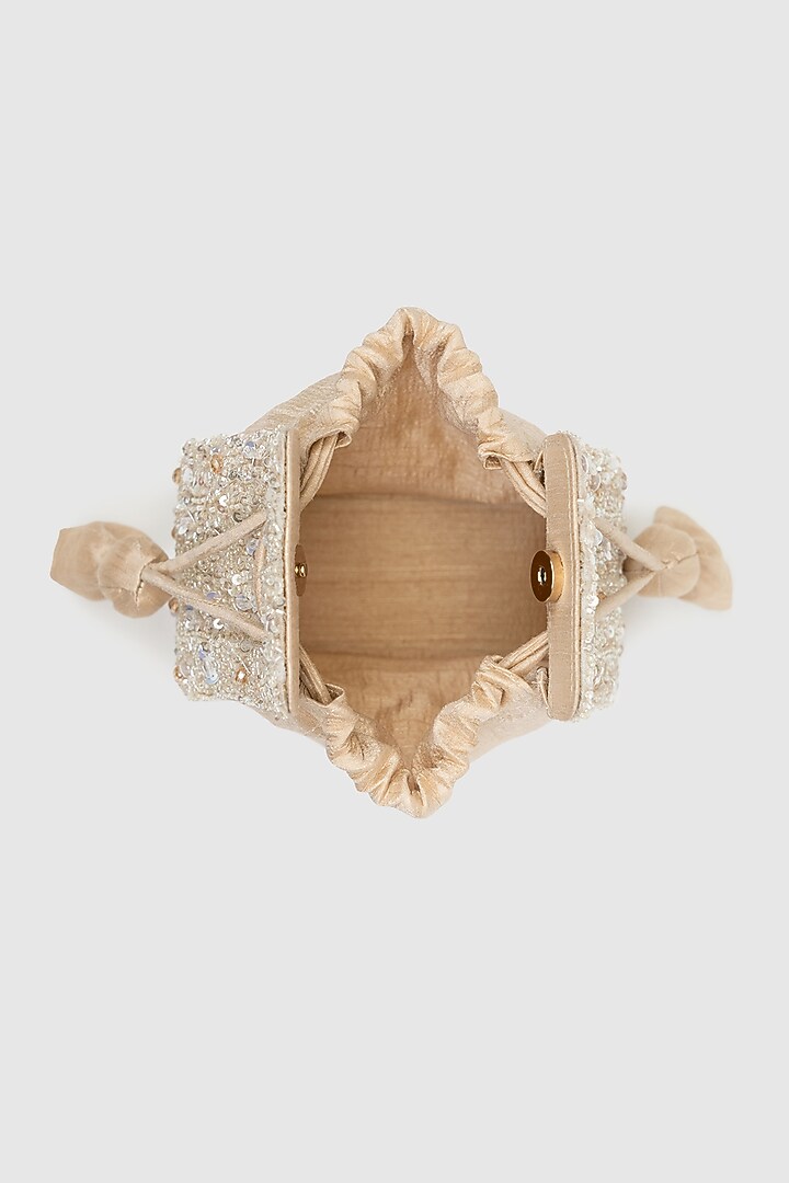 Beige Raw Silk Embellished Modak Potli by House of D'oro at Pernia's Pop Up Shop