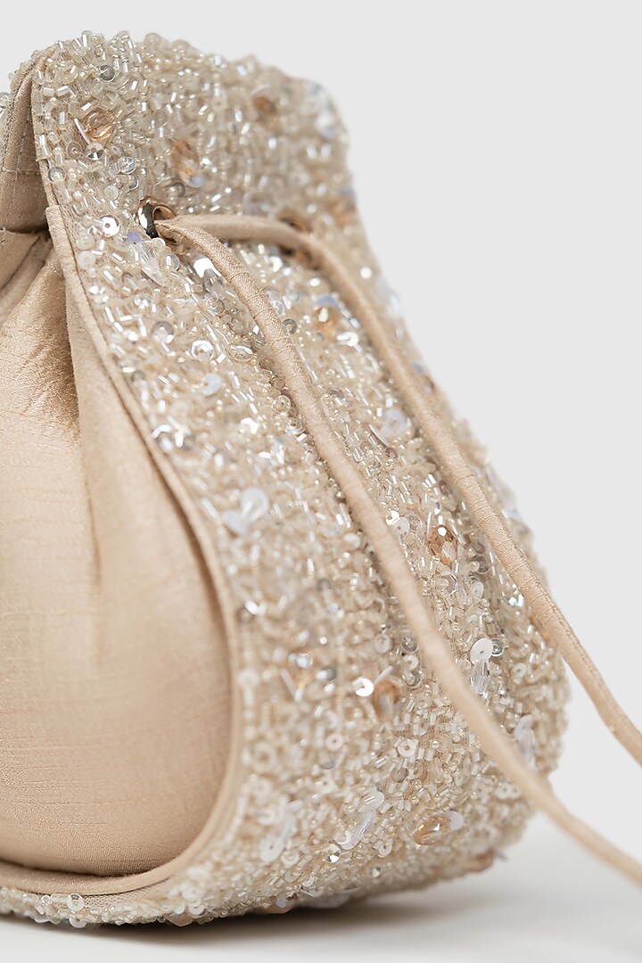 Beige Raw Silk Embellished Modak Potli by House of D'oro at Pernia's Pop Up Shop