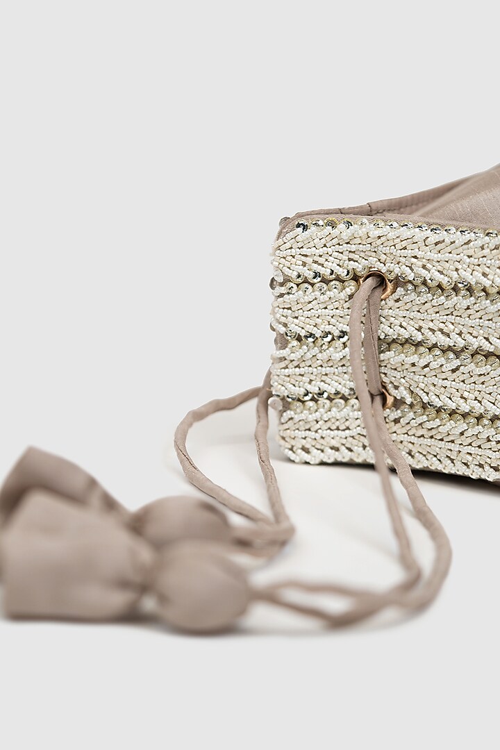 Ivory Raw Silk Embellished Modak Potli by House of D'oro at Pernia's Pop Up Shop