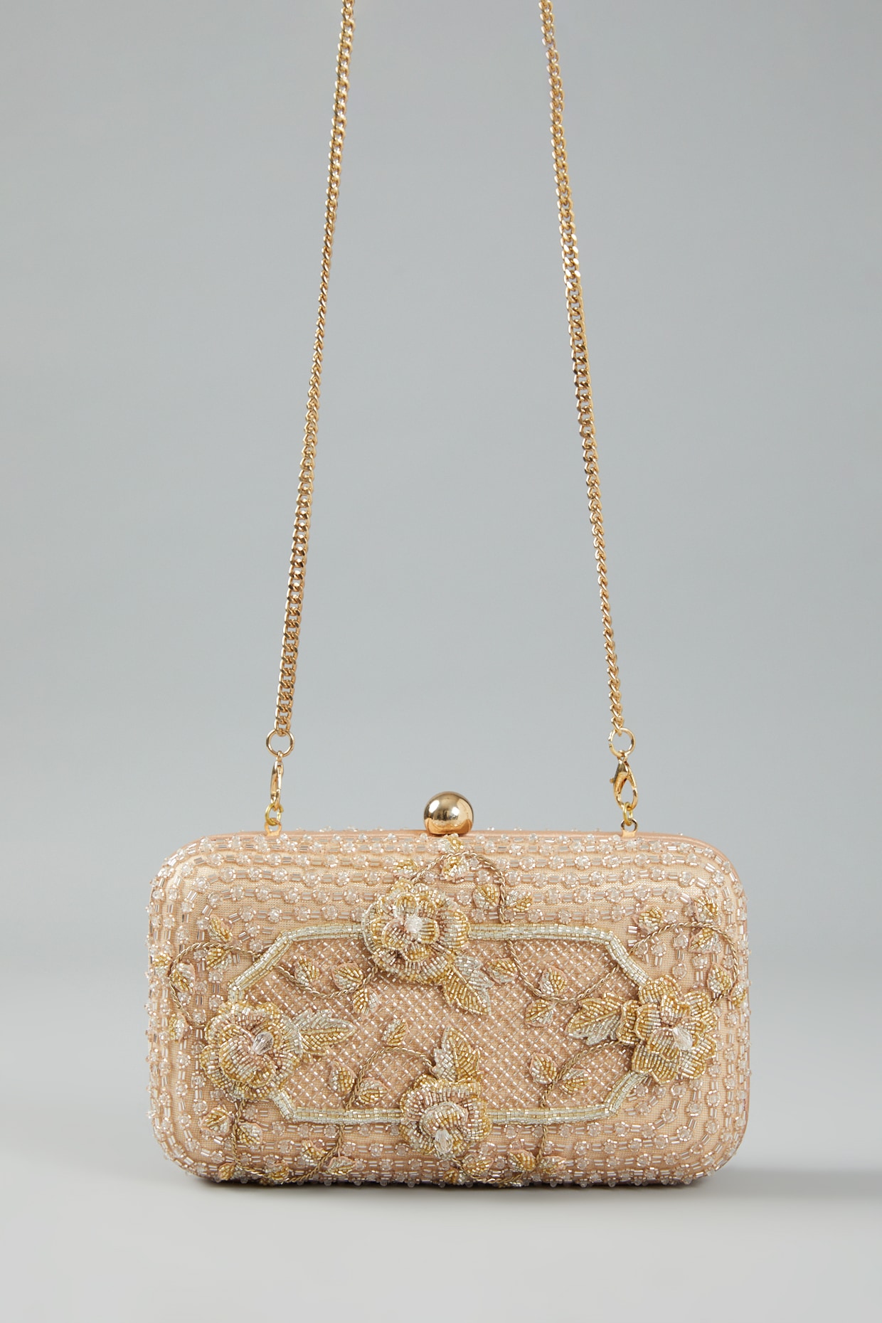 Gold embellished store clutch bag