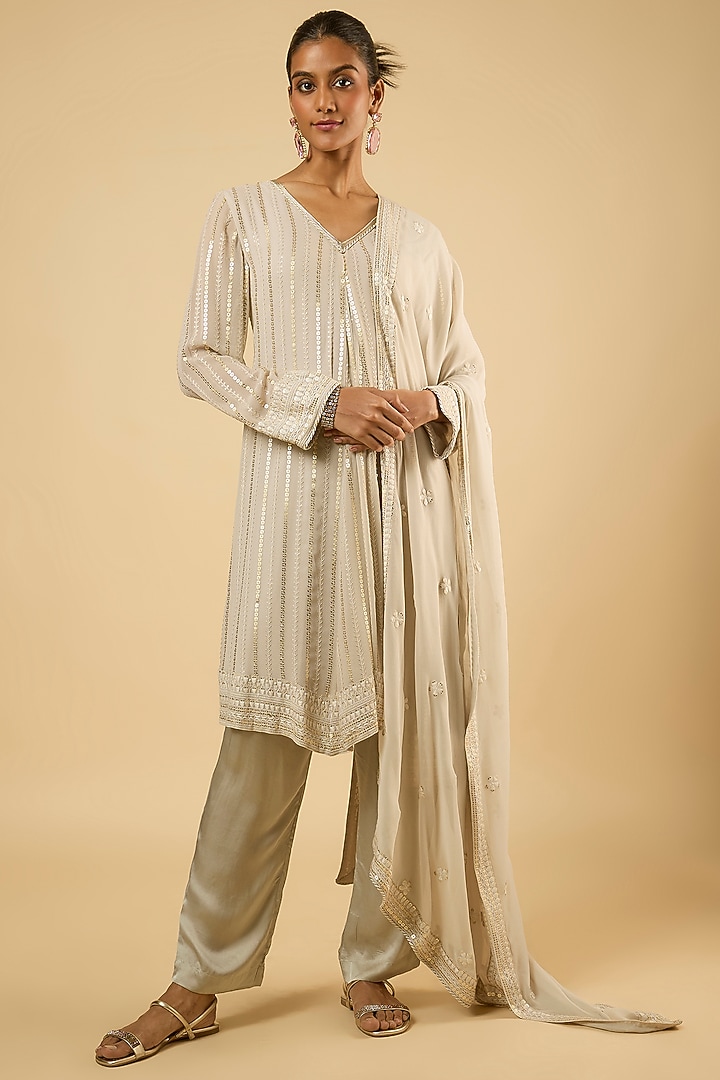 White Georgette Sequins Embroidered Asymmetric Kurta Set by Dori & Co. at Pernia's Pop Up Shop