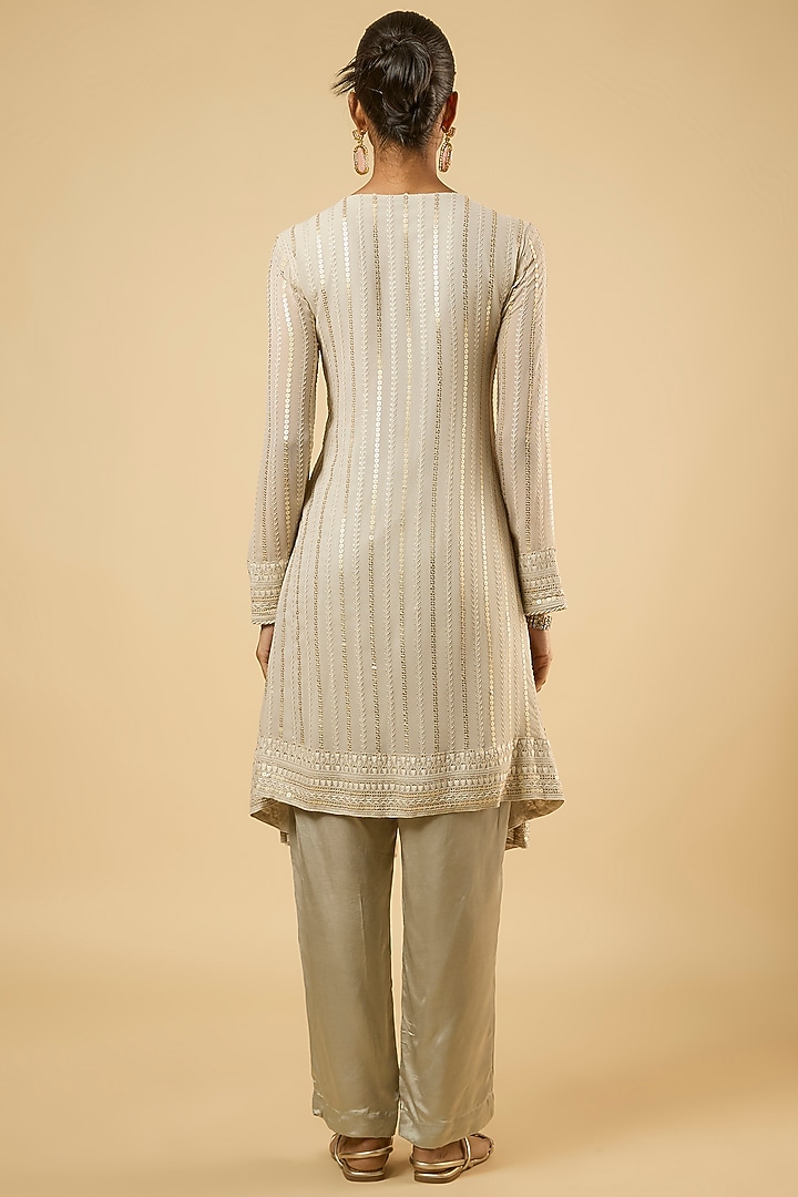 White Georgette Sequins Embroidered Asymmetric Kurta Set by Dori & Co. at Pernia's Pop Up Shop