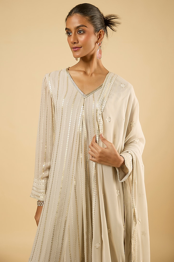 White Georgette Sequins Embroidered Asymmetric Kurta Set by Dori & Co. at Pernia's Pop Up Shop