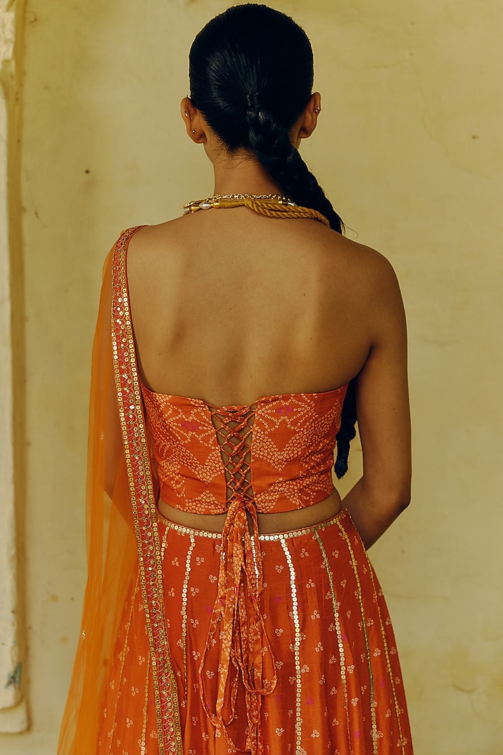 Rust Dupion Silk Bandhani Printed & Hand Embroidered Wedding Lehenga Set by Drishti & Zahabia at Pernia's Pop Up Shop