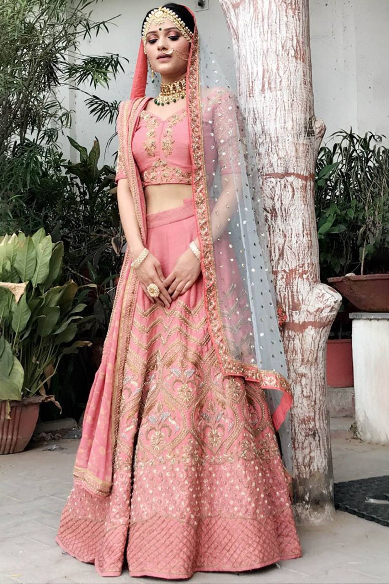 Bridal lehenga paired with pink color heavily embellished choli and net  heavy embroidered border in peach and maroon color. |lovelyweddingmall.com|