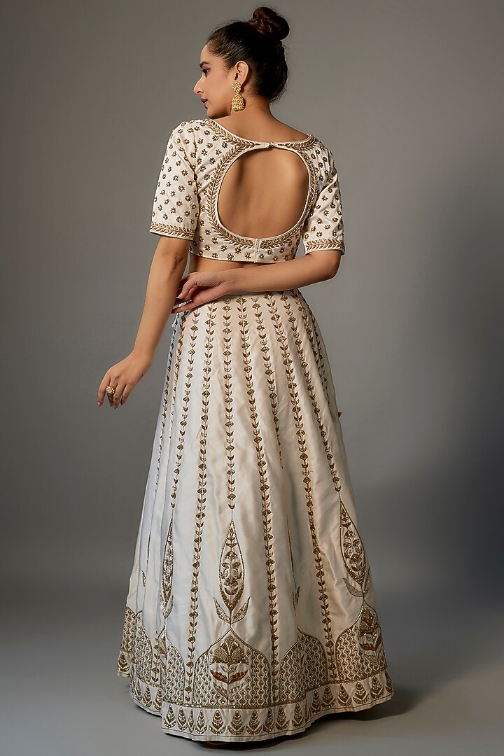 Ivory Linen Satin Embroidered Wedding Lehenga Set by Dhara Shah Studio at Pernia's Pop Up Shop