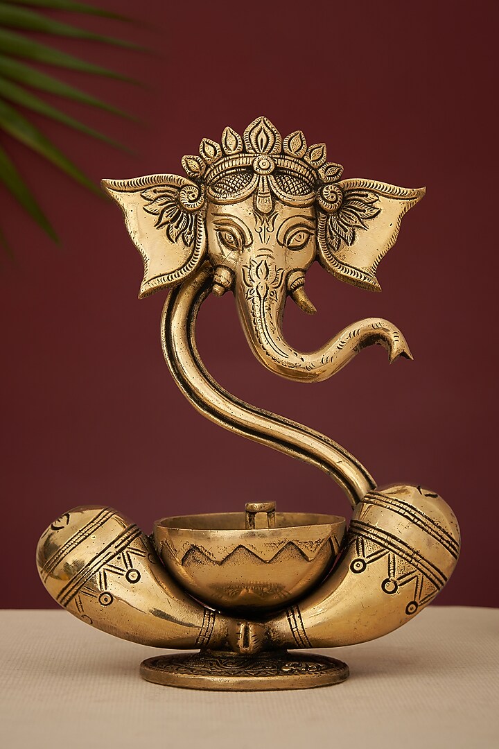Gold Brass Lord Ganesha Idol With Akhand Diya by DecorTwist at Pernia's Pop Up Shop