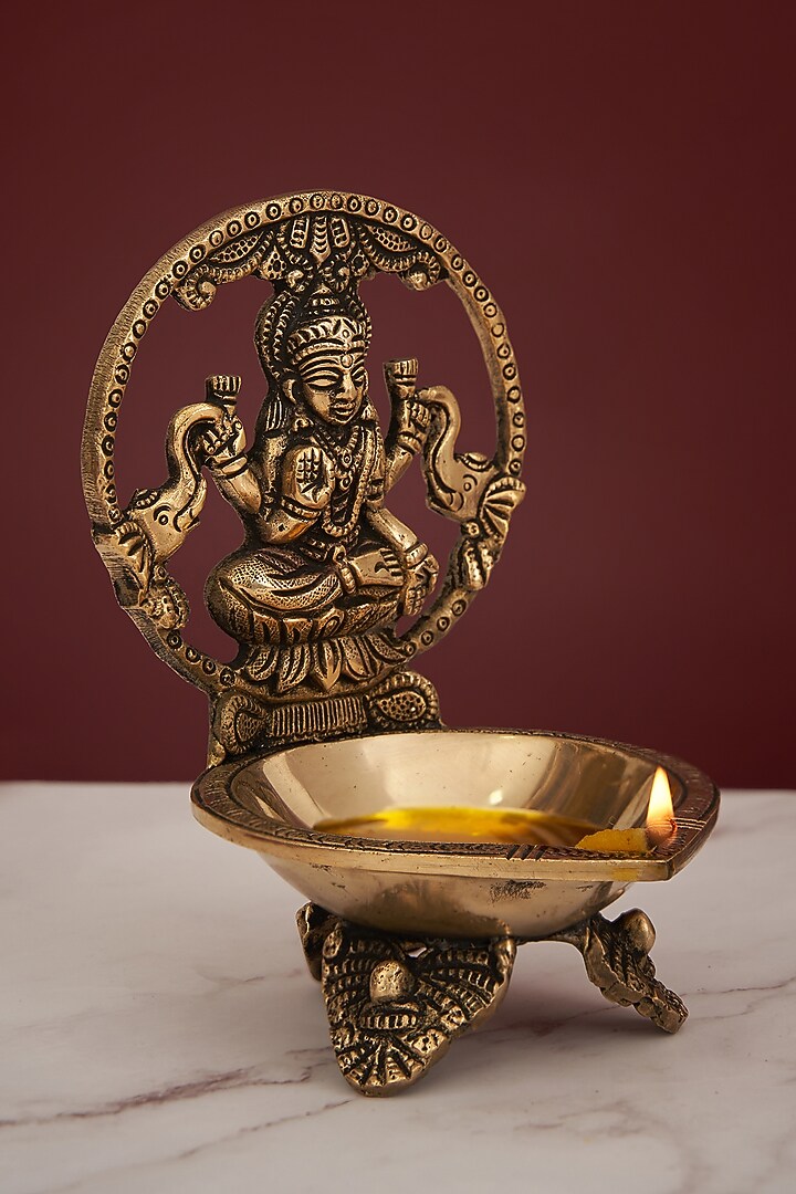 Golden Brass Laxmi Diya With Stand by DecorTwist at Pernia's Pop Up Shop