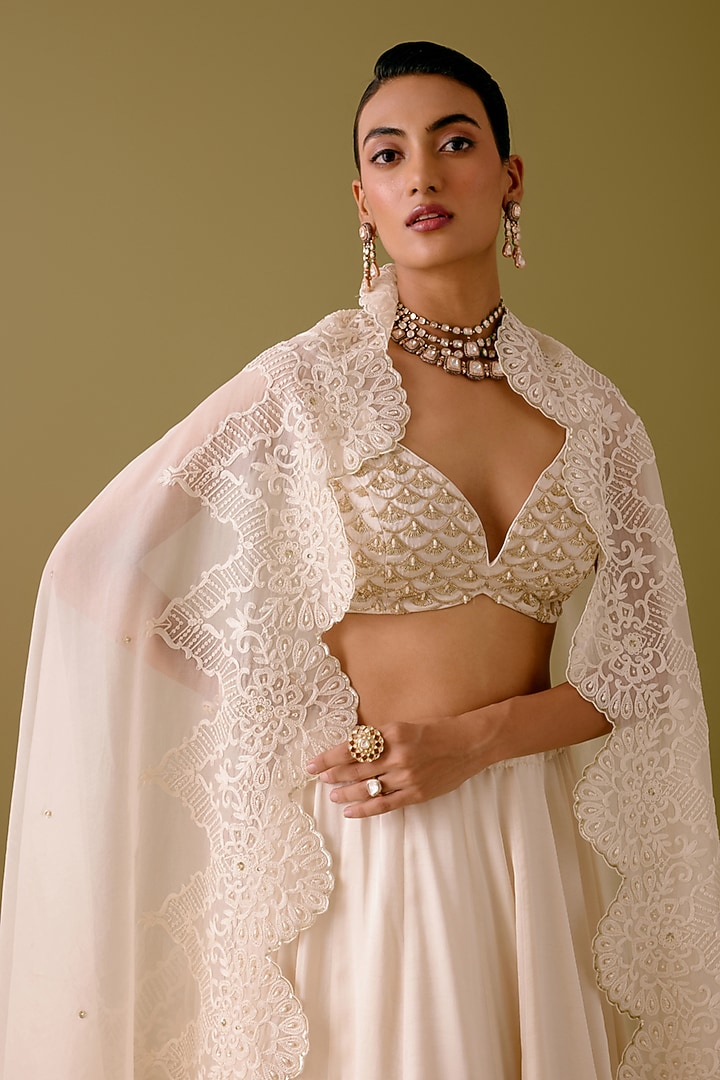 Ivory Silk Satin Dori Embroidered Bridal Lehenga Set by Devnaagri at Pernia's Pop Up Shop