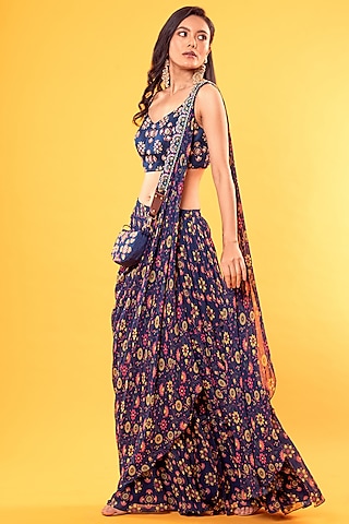 Cobalt Blue Georgette Jaal Printed Saree Set With Potli Bag by DiyaRajvvir