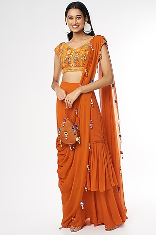 Rust Georgette Skirt Saree Set With Potli Bag by DiyaRajvvir