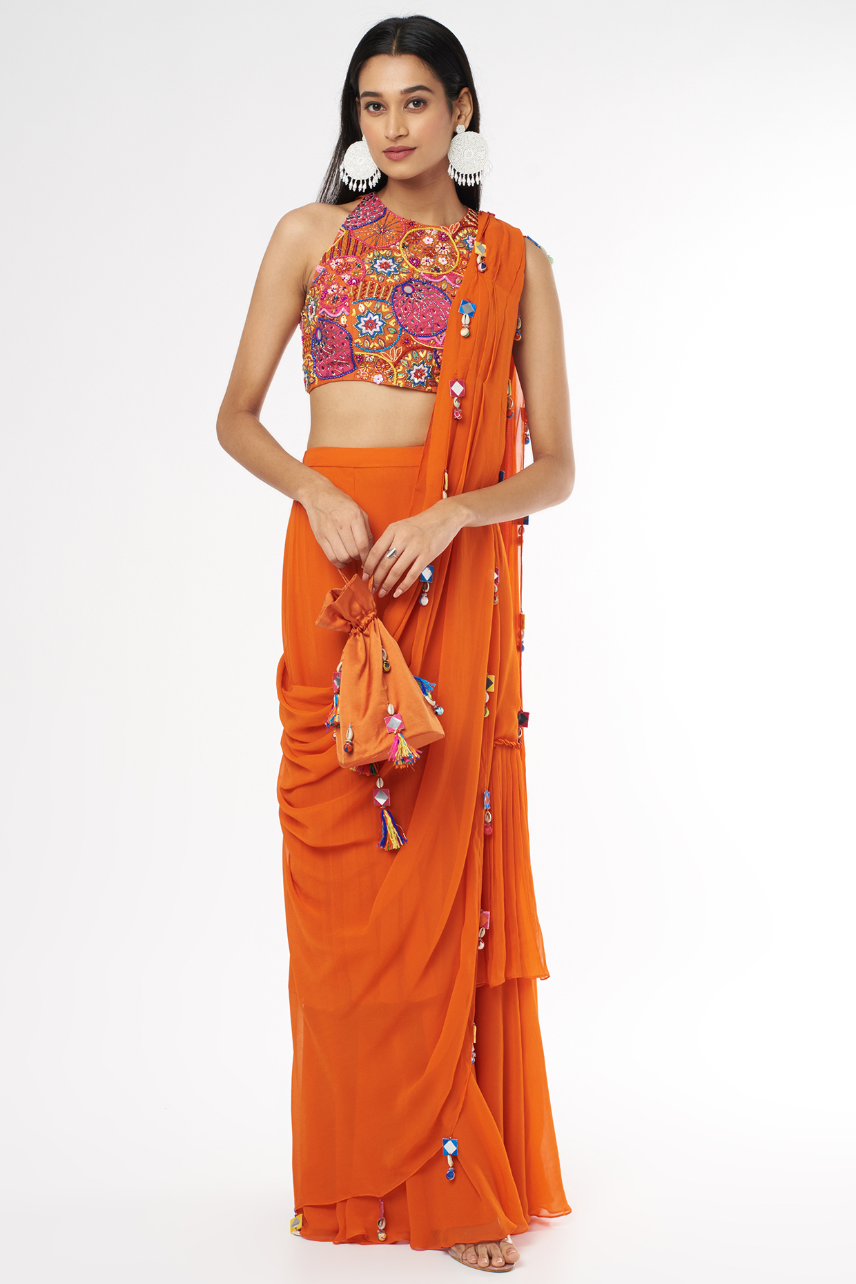 Rust Georgette Tasseled Skirt Wedding Saree Set With Potli Bag by DiyaRajvvir at Pernia's Pop Up Shop