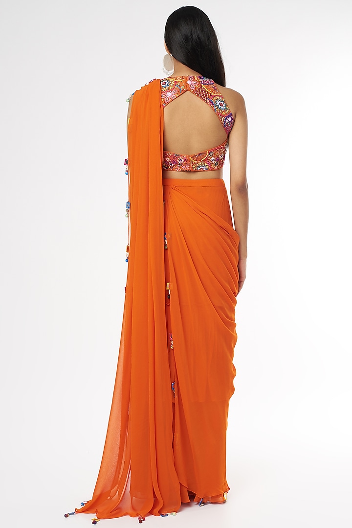 Rust Georgette Tasseled Skirt Wedding Saree Set With Potli Bag by DiyaRajvvir at Pernia's Pop Up Shop