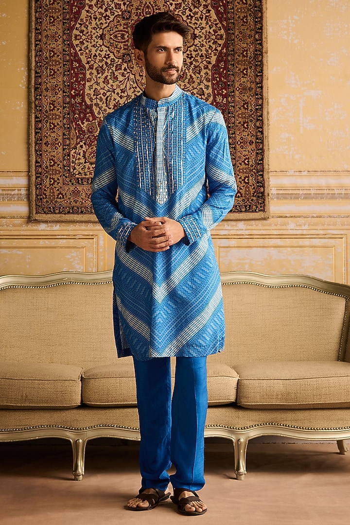 Blue Dola Silk Chevron Printed & Mirror Embellished Bundi Jacket Set by DiyaRajvvir Men at Pernia's Pop Up Shop