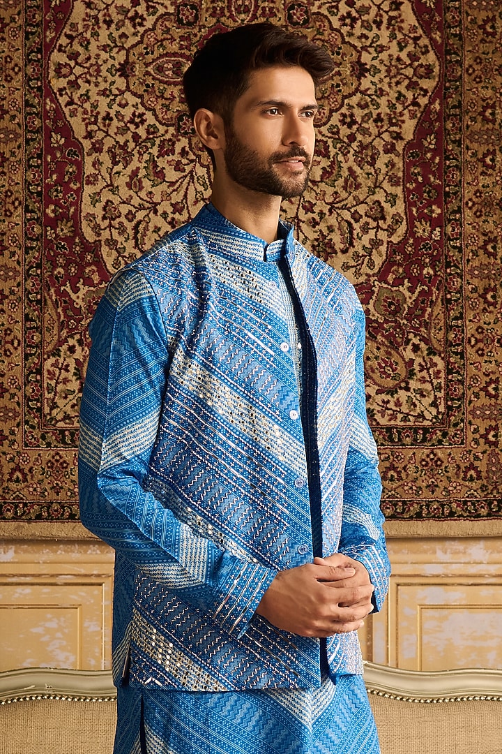 Blue Dola Silk Chevron Printed & Mirror Embellished Bundi Jacket Set by DiyaRajvvir Men at Pernia's Pop Up Shop