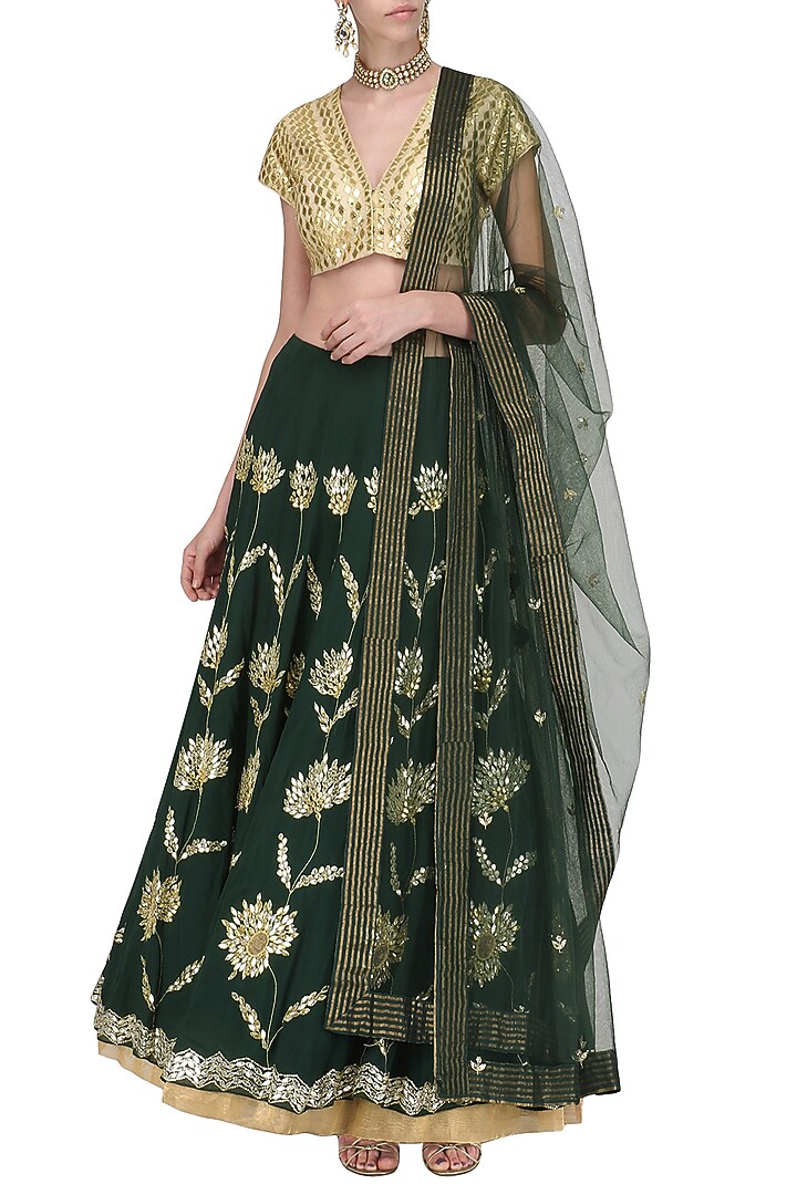 Emerald green and gold embroidered lehenga set available only at Pernia's Pop Up Shop.