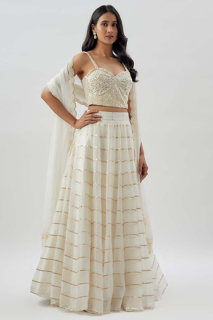 Ivory Organza Striped Wedding Lehenga Set by Divya Kanakia at Pernia's Pop Up Shop