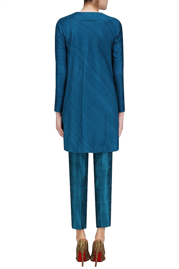 Teal blue front open cape and pant suit available only at Pernia's Pop Up Shop.