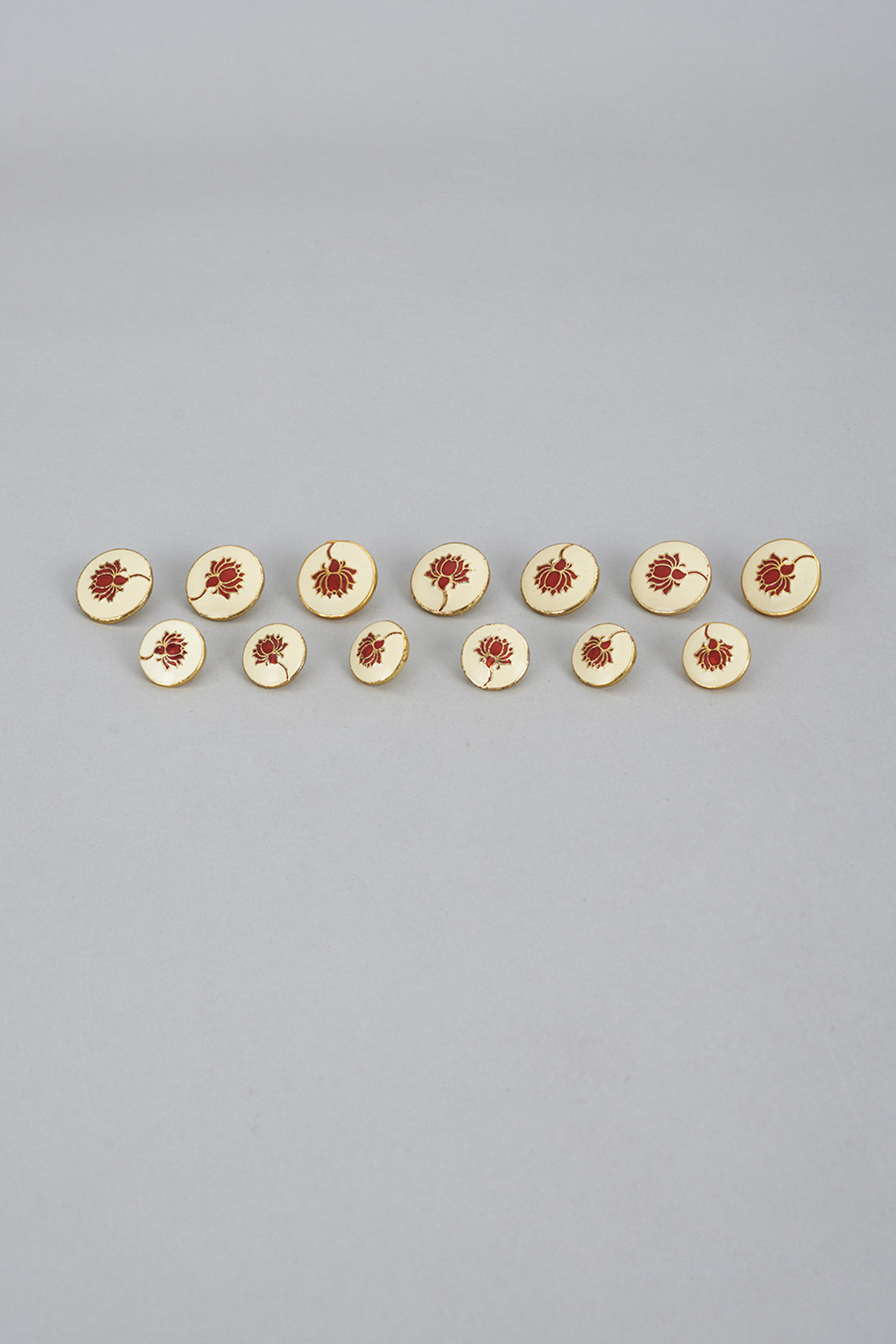 Red Brass & Copper Meenakari Buttons (Set of 13) by Ekam by Manish Gupta at Pernia's Pop Up Shop