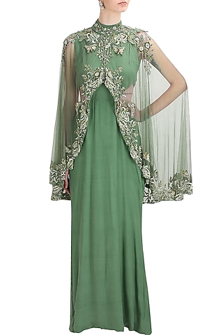 Green cutout goddess gown with embroidered high low sheer cape by Elysian By Gitanjali