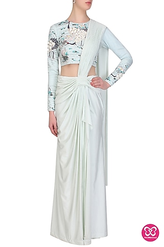 Aqua pleated lycra saree with birds embroidered blouse by Eshaani Jayaswal