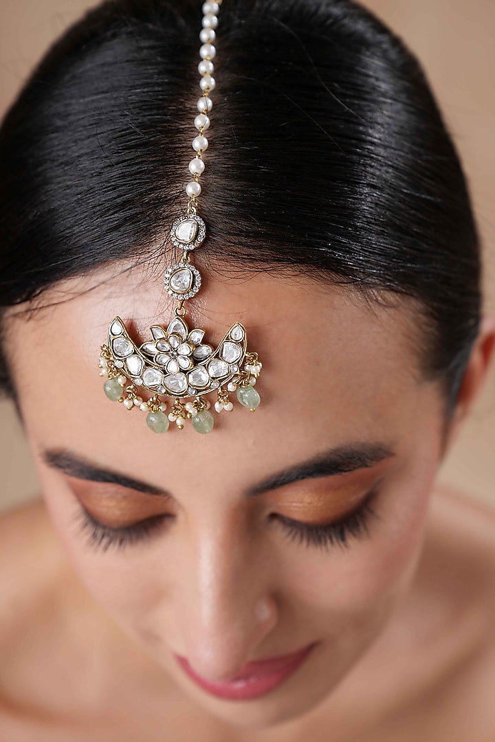 Gold Finish Moissanite Polki & Aqua Stone Maangtikka by EKATHVA JAIPUR at Pernia's Pop Up Shop
