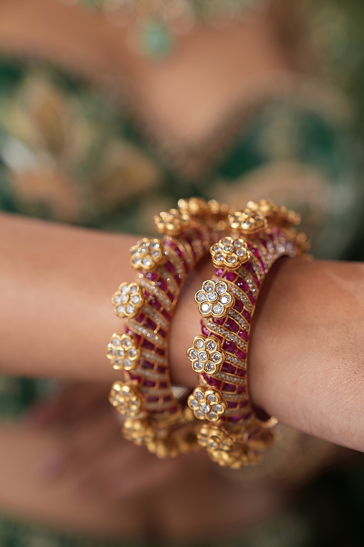 Gold Finish Kundan Polki & Red Stone Bangles (Set Of 2) by EKATHVA JAIPUR at Pernia's Pop Up Shop